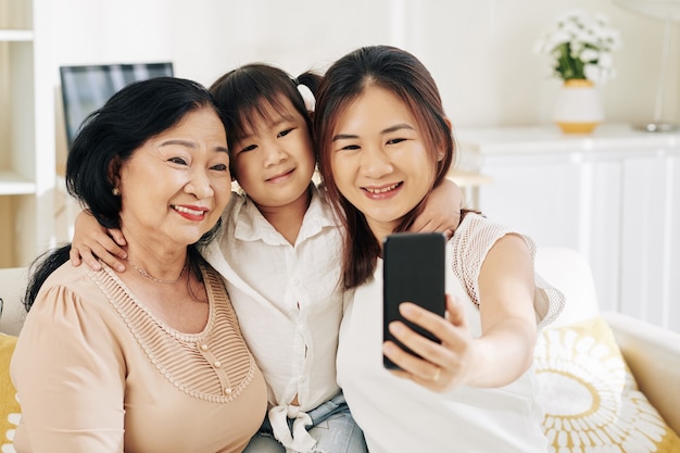 Hugging family taking selfie