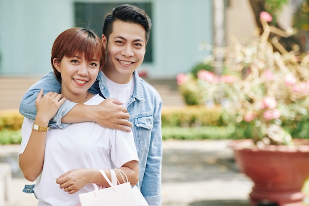 Hugging young Vietnamese couple