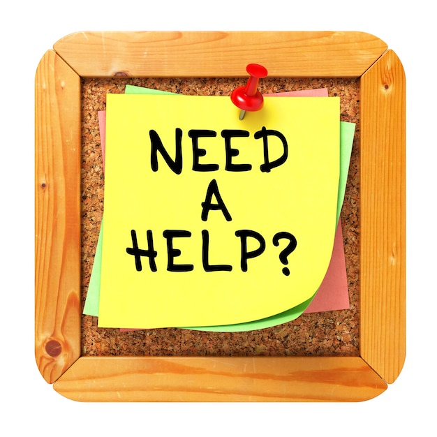 Hulp nodig? gele sticker op kurk bulletin of prikbord