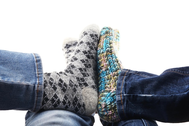 Human feet in knitted socks isolated on white