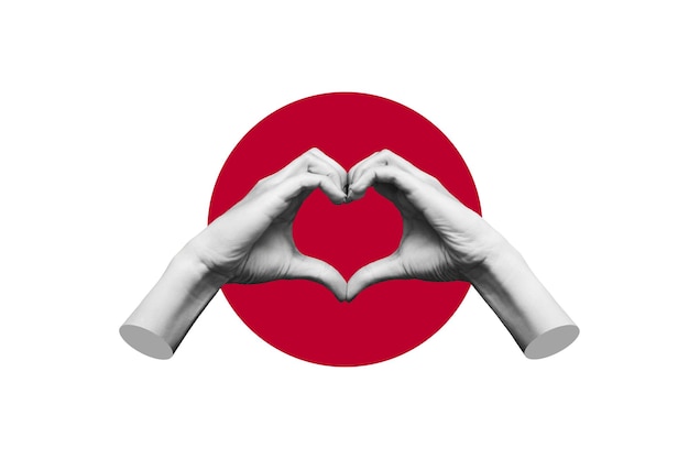 Photo human female hands showing a heart shape isolated on a background of the flag of japan