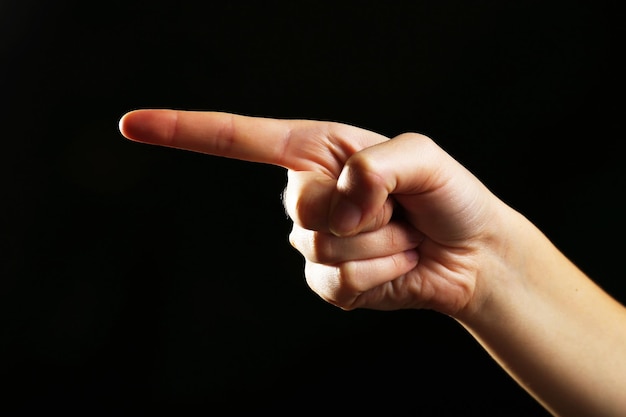 human hand on black background
