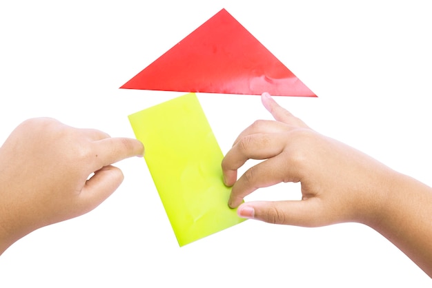 Human hand folding a colored paper isolated over white background