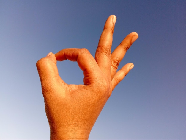 Photo human hand forming ok sign