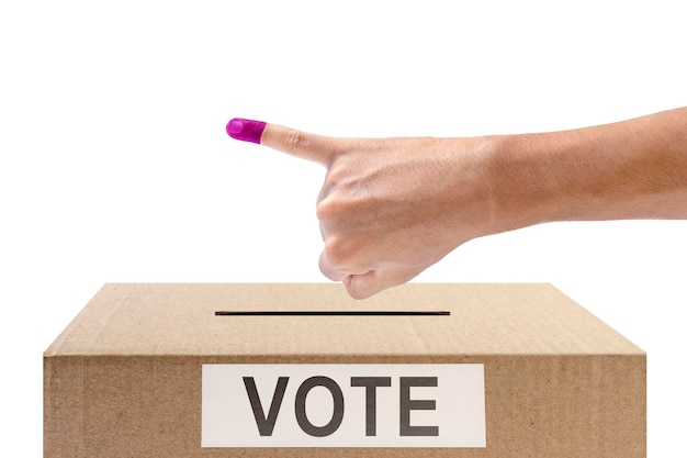 Human hand gesture after inserting vote paper into ballot box isolated over white background Election concept