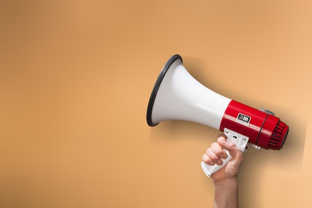 Human hand hold the classic megaphone