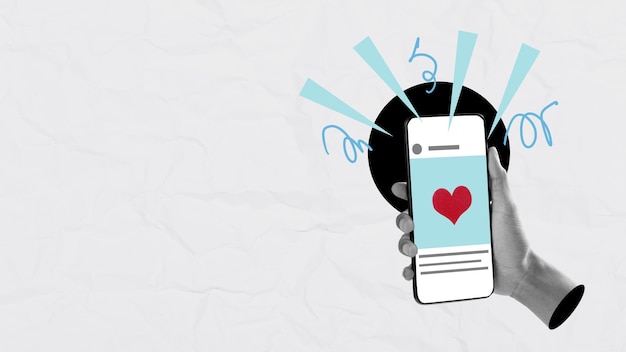 a human hand holding a mobile phone with a red heart on the screen