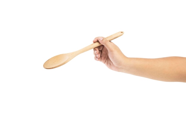 Human hand holding wooden spoon isolated over white background