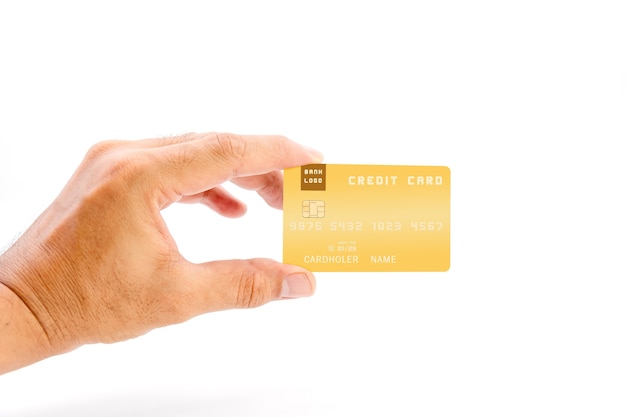 白い背景に黄色の銀行のクレジットカードを保持している人間の手、ビジネスや金融の概念に使用します。