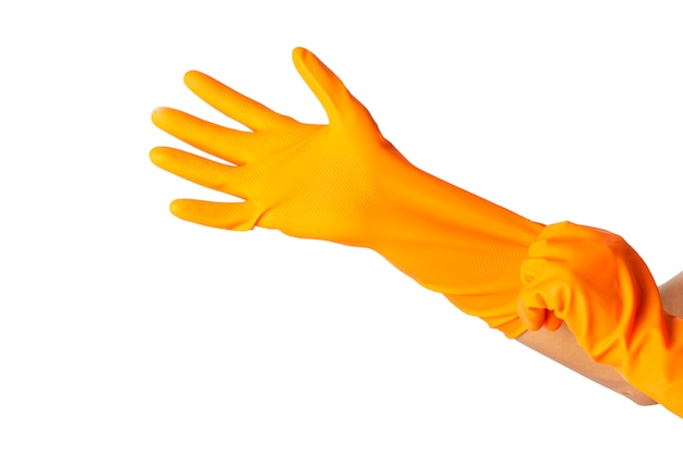 Human hand is wearing a protective orange rubber glove isolated on white background.