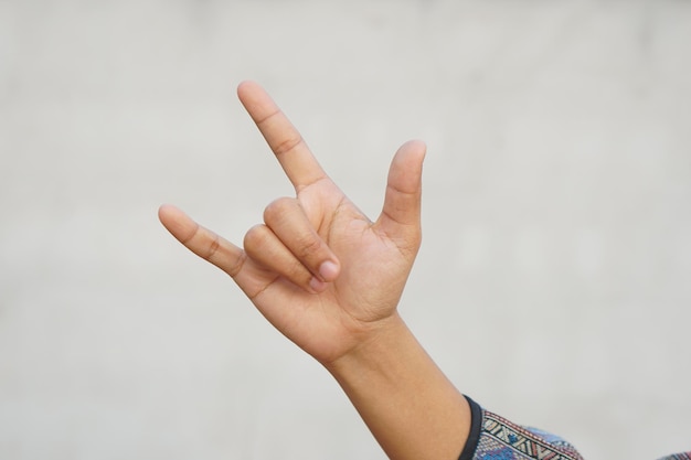 Human hand making a love sign