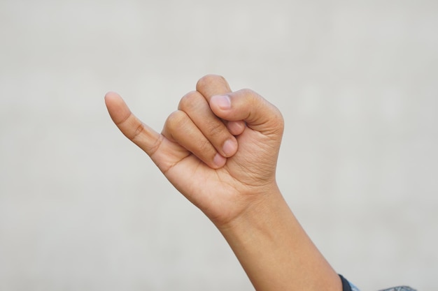 Human hand making a sign of reconciliation