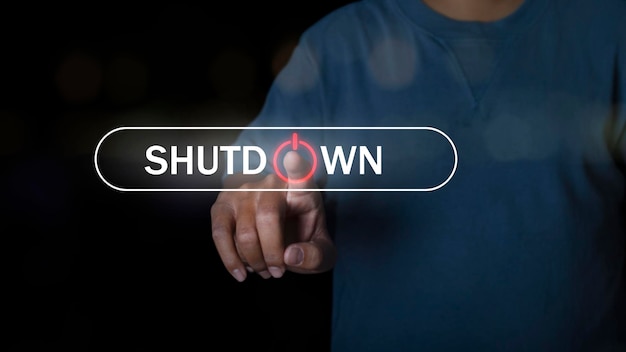 Human hand press shutdown button on virtual screen in the slide bar to unlocks. concept of system shutdown or stops working.