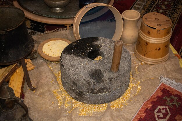 Human hand rotated ancient stone grinding machine for smashing grains