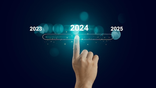 Photo human hand touch on virtual bar status to change from 2023 to 2024 and 2025 for preparation