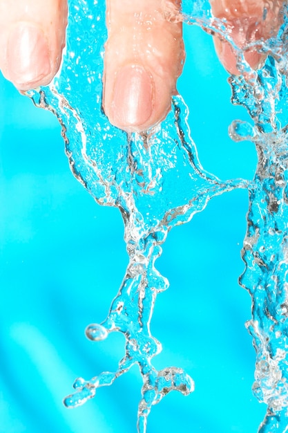 Human hand with current water.