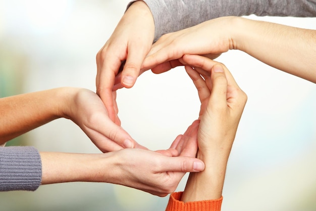 Human hands on bright background