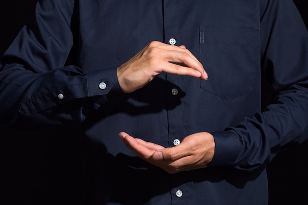 Human hands carry gestures in blue clothes