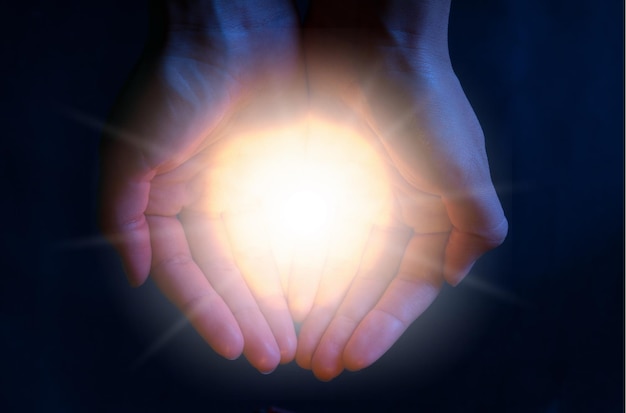 Human hands holding flash light on background