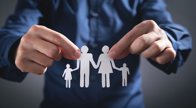 Human hands showing paper cut family.