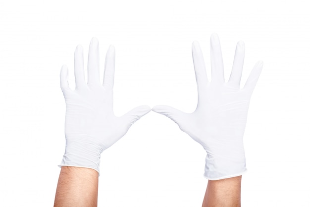 Human hands wearing white latex medical glove