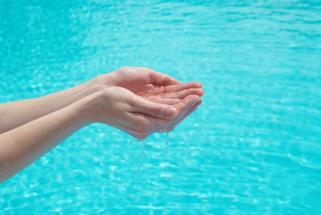 Human hands with clear water