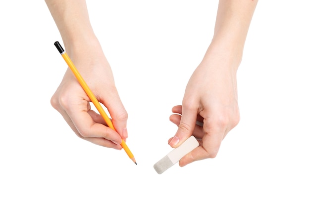 Human hands with pencil and erase rubber, isolated on white