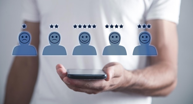 Human icons with positive and sad face stars Customer evaluation and satisfaction