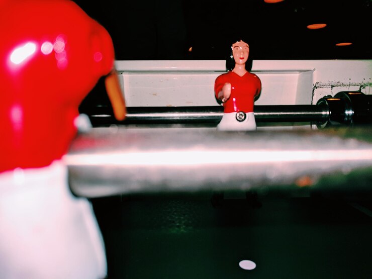 Photo human representations on foosball table