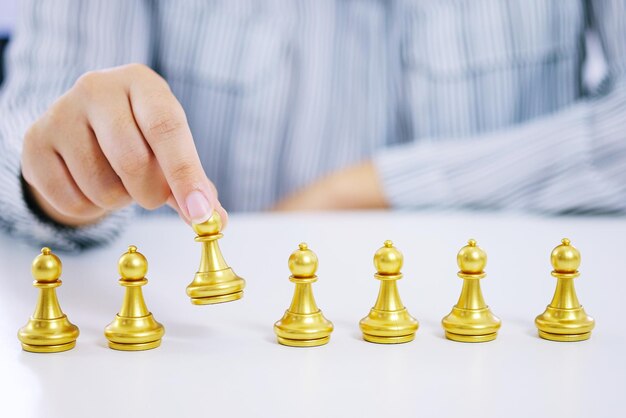 Human resources concept career management with clasped hands planning strategy with chess figures