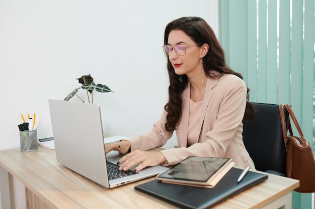 Human Resources Manager Working on Laptop