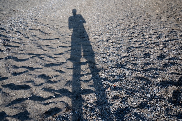 Human shadow on the sand.