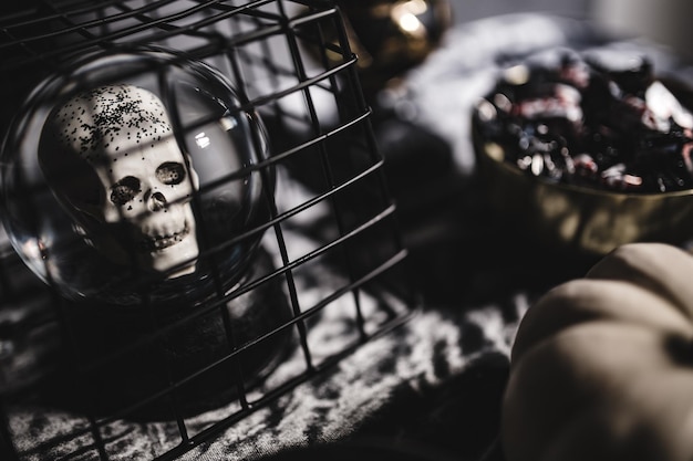 Photo human skull in a bottle happy halloween decor