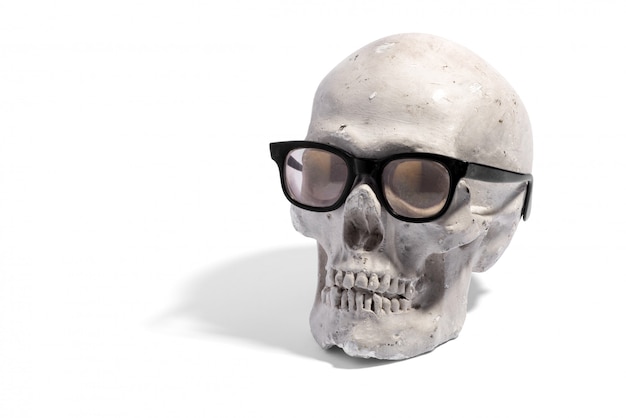 Human skull wearing spectacles or eyeglasses