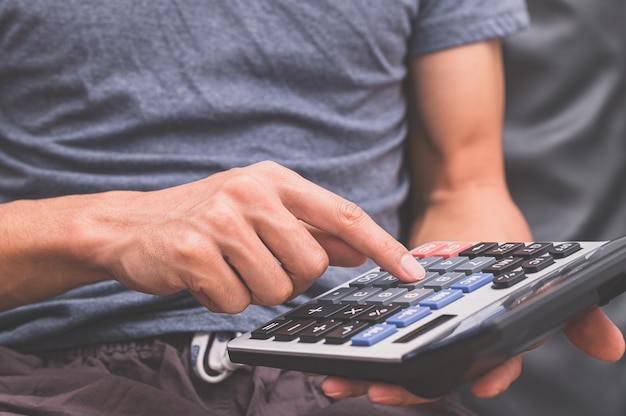 A human using a calculator