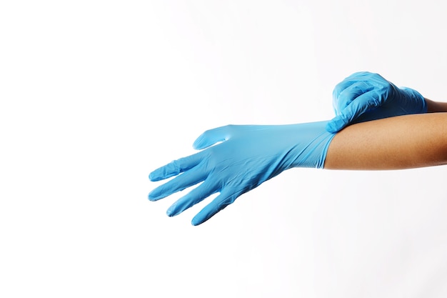 Human wearing glove on white background.