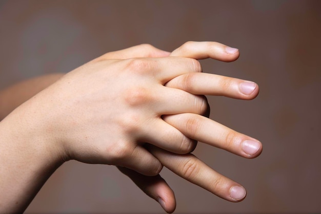 Photo human with fingers interlocked gesture close up