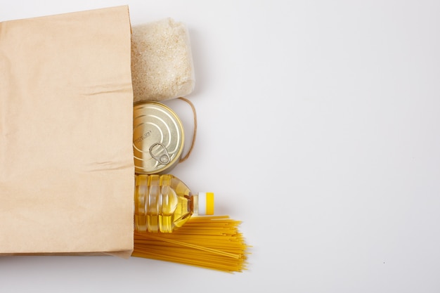 humanitarian aid, vegetable oil can of cereals on a white background place for text