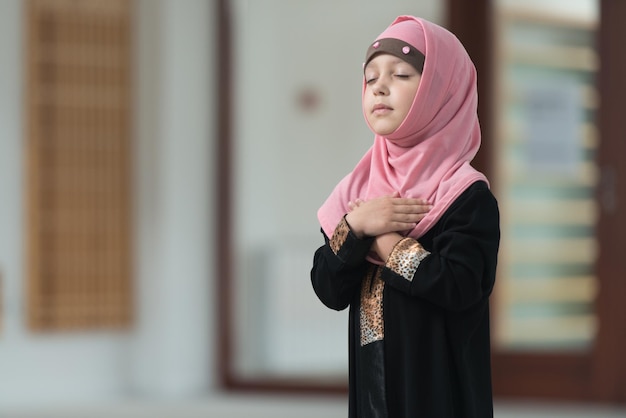 Humble Muslim Child Is Praying In The Mosque