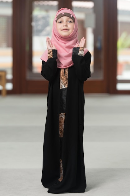 Humble Muslim Child Is Praying In The Mosque