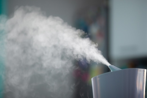 Photo humidifier spreading steam into the living room