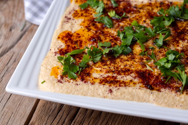 Hummus chickpea on plate traditional delicious Turkish food Turkish name Humus