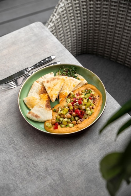 Hummus plate with pita bread Middle Eastern traditional appetiser