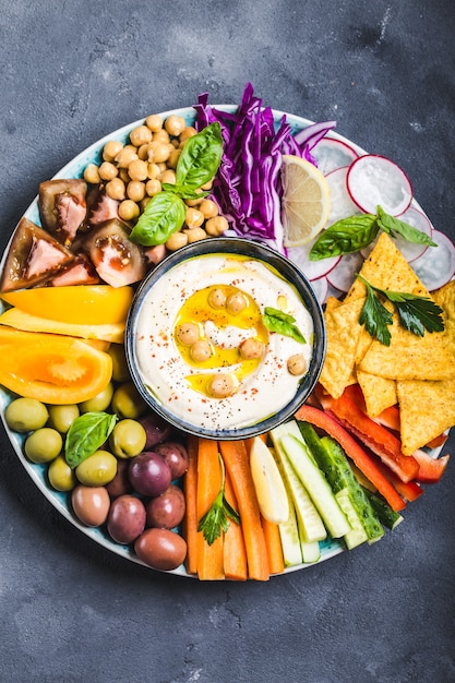 Hummus platter with assorted snacks