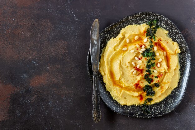 Hummus on a rusty background. Pete. Recipes. Vegetarian food. Healthy eating.