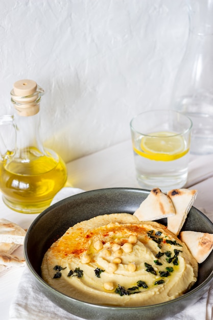 Hummus on a white background. Pete. Recipes. Vegetarian food. Healthy eating.