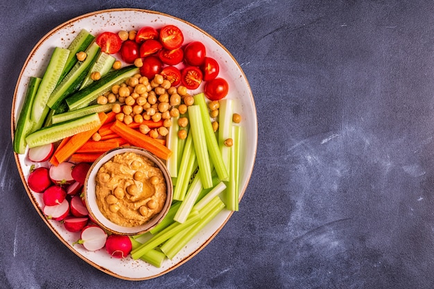 Hummus with various fresh raw vegetables