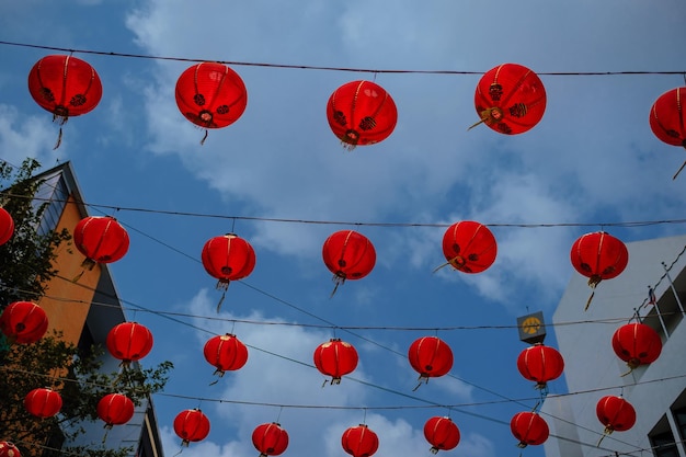 Hundreds of lanterns hung across the courtyard in preparation for the coming Chinese New Year over blue sky