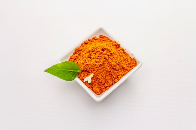 Hungarian hot paprika powder isolated on white