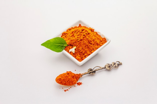 Hungarian hot paprika powder isolated on white